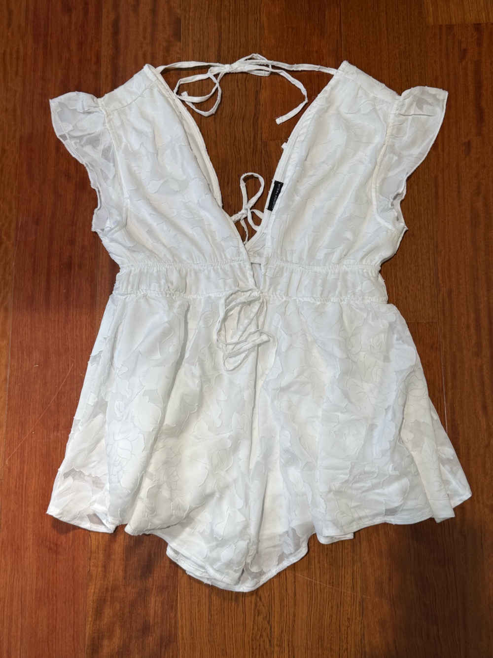 White Feminine Lined Large Textured Flowy Airy Tie Back Mini Romper